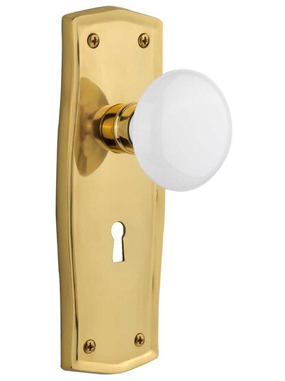 Prairie Design Mortise Lock Set With White Porcelain Door Knobs in Un-Lacquered Brass.